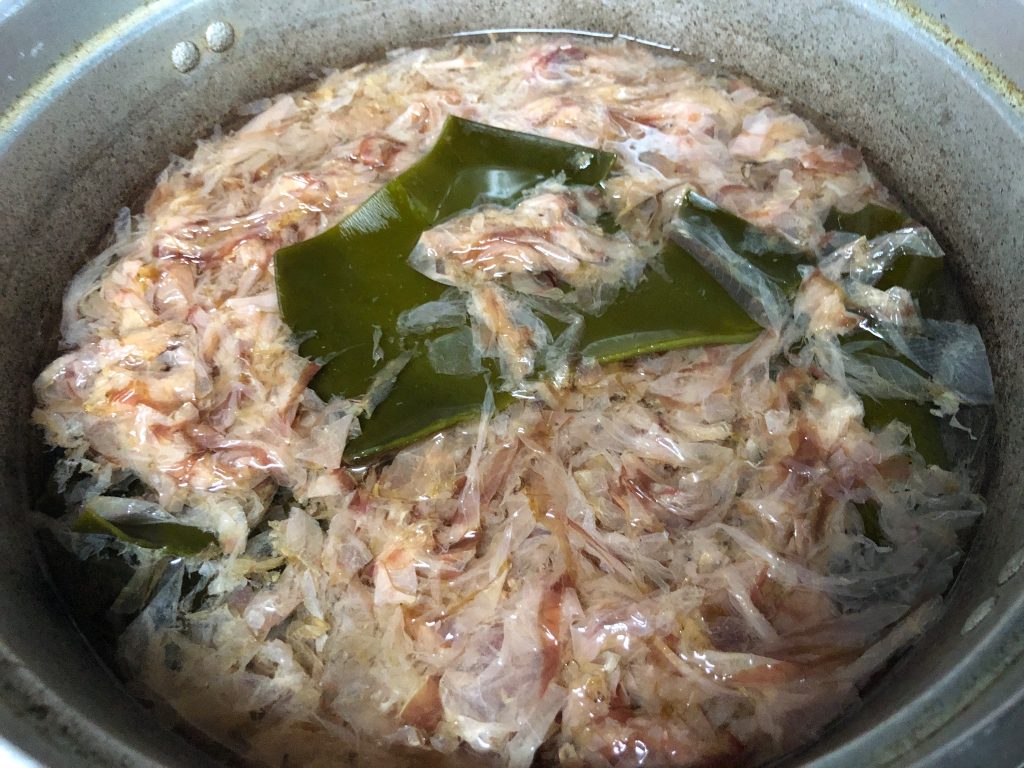 `Kombu and katsuobushi together in a stockpot during dashi extraction