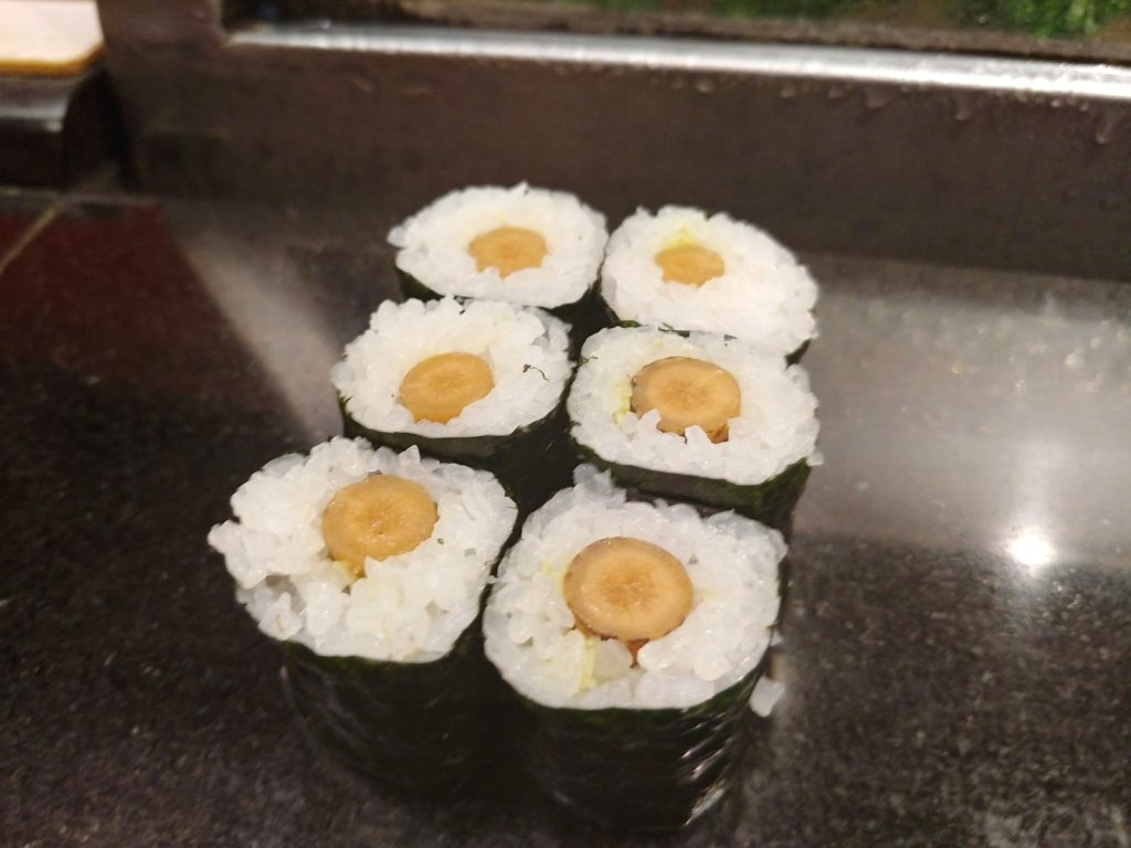 Pickled Gobo Hosomaki Pickled gobo hosomaki served at a Japanese sushi counter