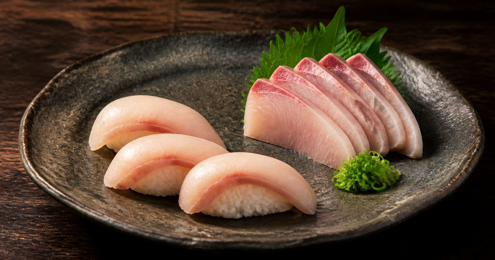 Hamachi yellowtail nigiri and sashimi on a Japanese ceramic plate