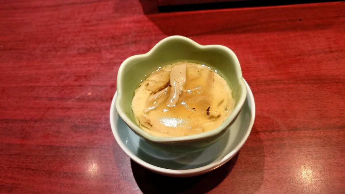 Matsutake slices arranged on the surface of Japanese steamed egg custard