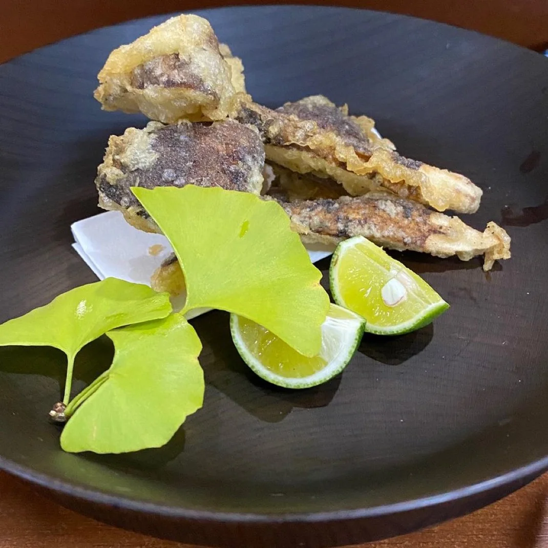 Matsutake mushroom tempura served with sudachi citrus and green ginkgo leaves